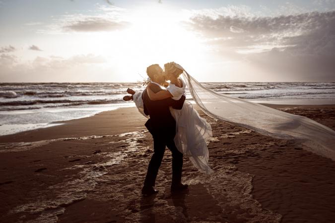 
	spouses at sunset by the sea
