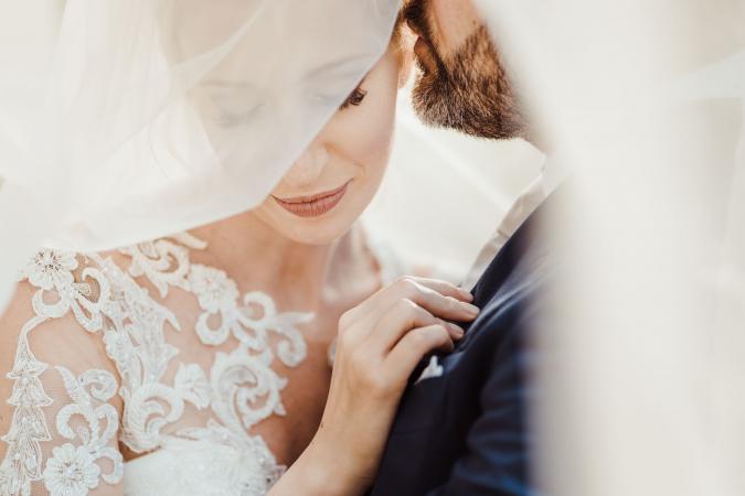 
	bride and groom under the veil
