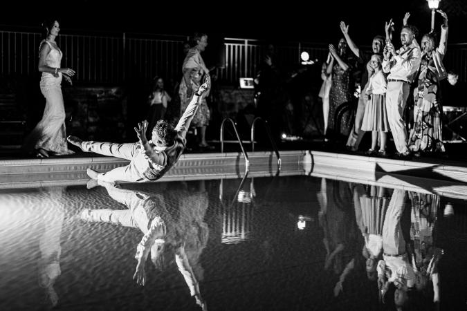 
	groom diving in the pool
