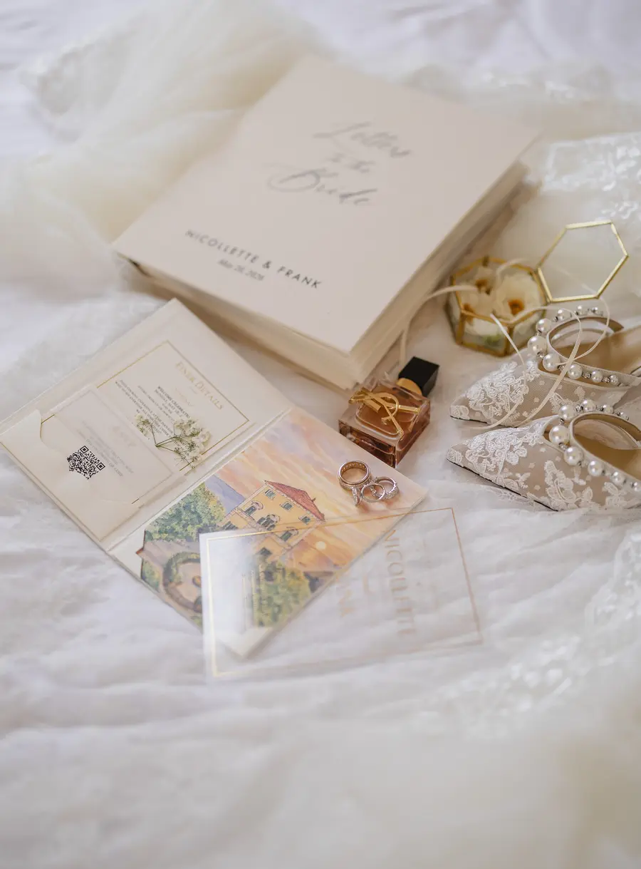 Bridal details: Letter to the Bride book, invitation suite, perfume, rings and lace shoes