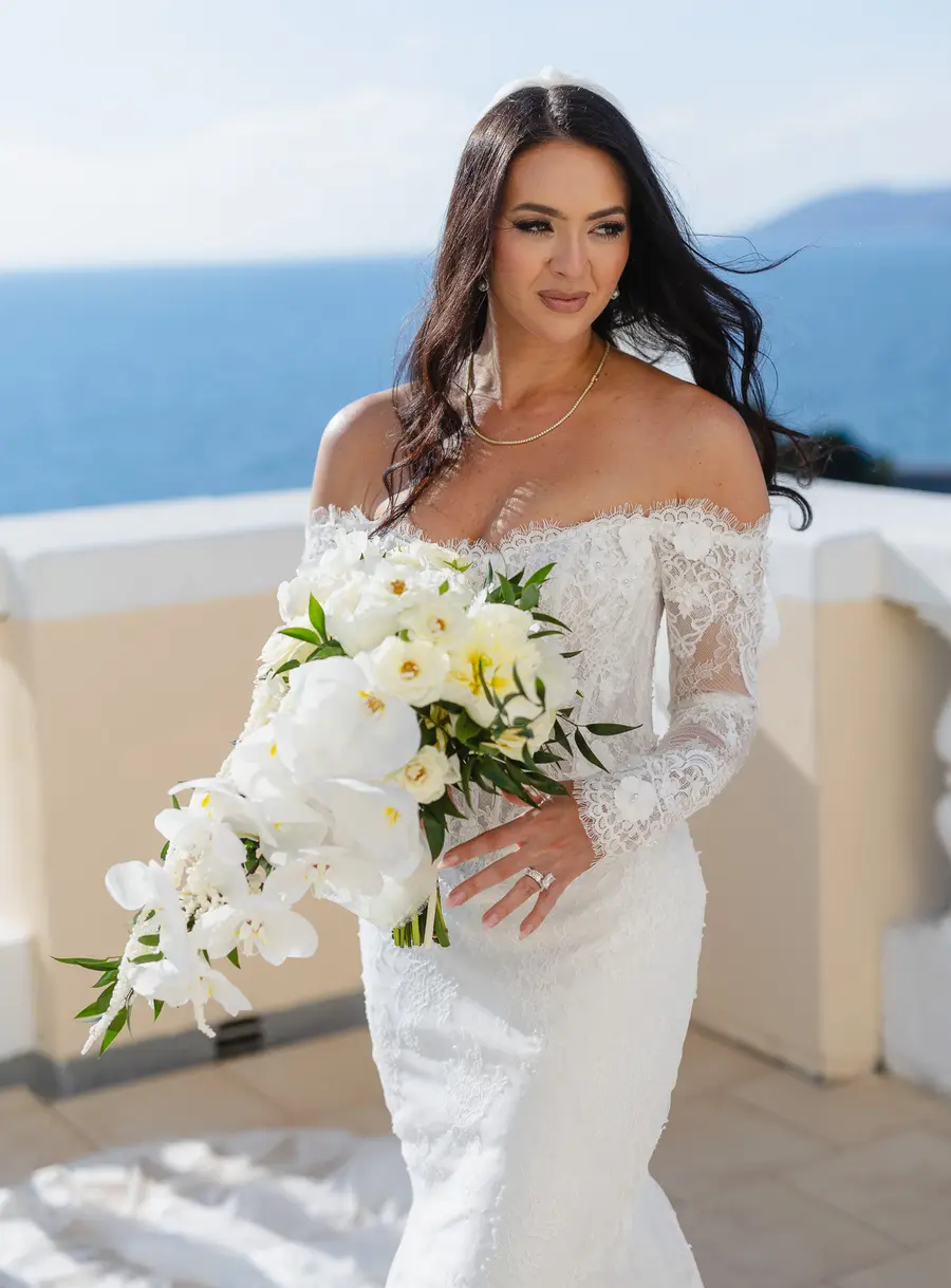 Portrait of the bride with an orchid and white rose bouquet, Villa Parisi wedding