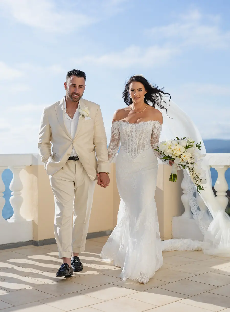 Frank and Nicolette hand in hand on the sea terrace, Castiglioncello wedding